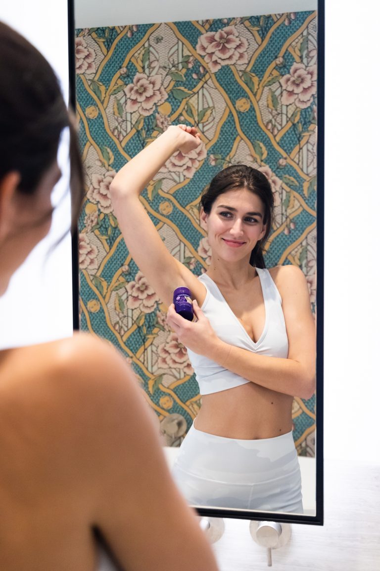 Photo by No Revision on Unsplash of woman in white tank top smiling